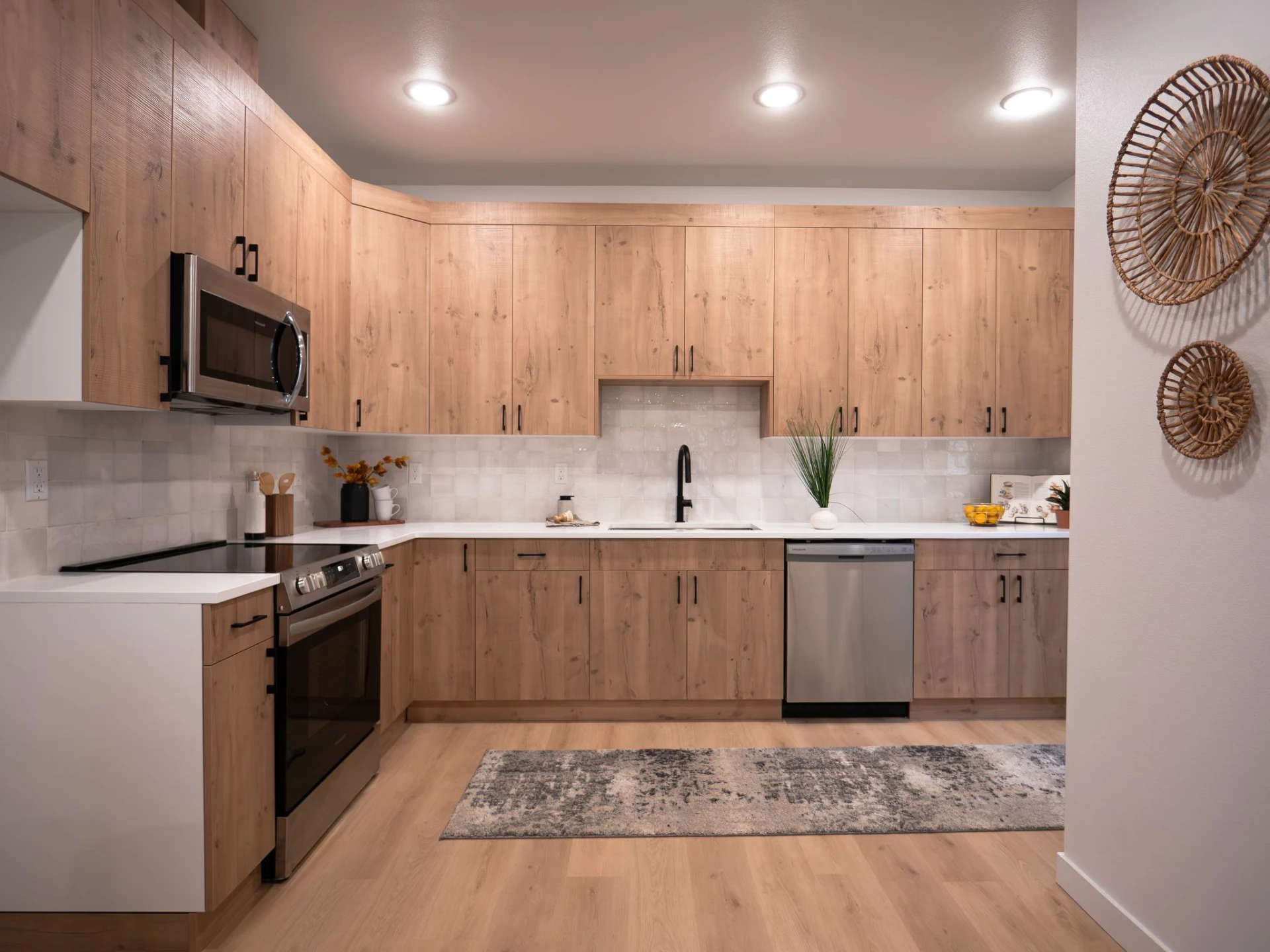 Harris & Sons finished kitchen with oak cabinetry and white counters